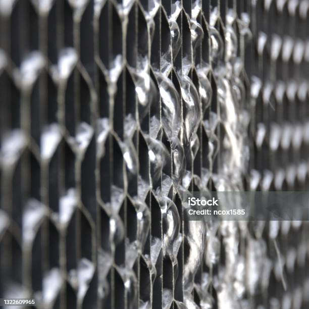 Closeup View Of Water Leak Or Losses Flowing From The Plastic Air Intake Louvre On A Cooling Tower System Stock Photo - Download Image Now