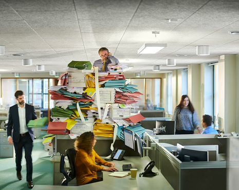 office worker gets yet more work from his boss