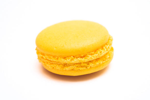 istock Various flavors of pastel macarons stacked against isolated on white background. 1322614122