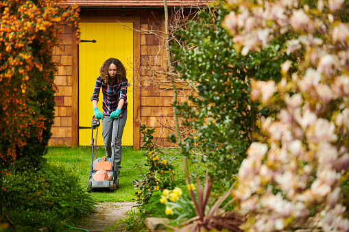 woman mowing her lawn