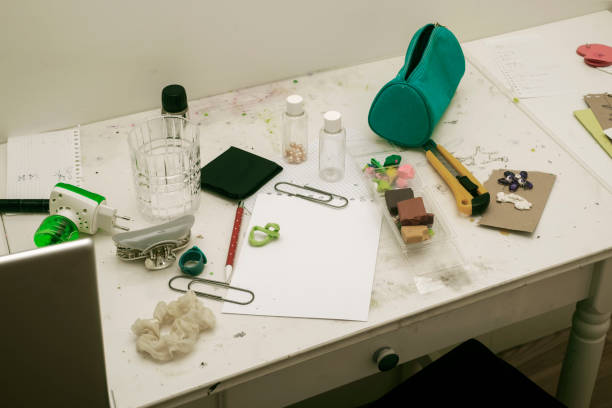 istock schoolgirl messy desk 1322617078
