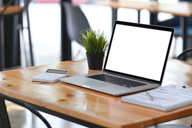 istock Accountant workplace with laptop computer, calculator and documents on wooden desk. 1322621589
