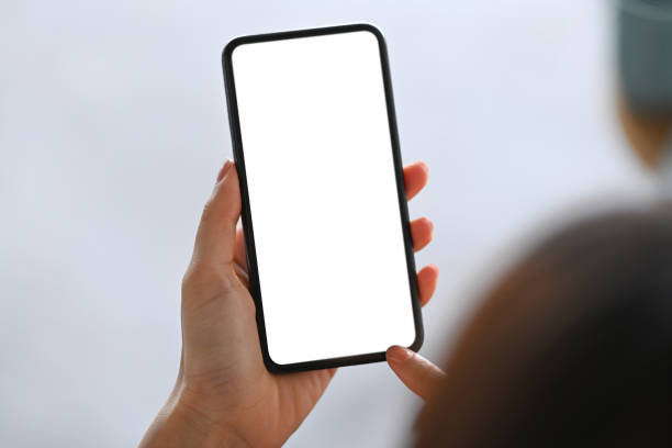 istock Mock up image of woman holding mobile phone with empty screen. 1322621626