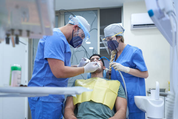 istock Young men in a dental clinic having his teeth checked 1322622289