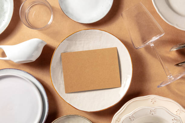 istock Invitaion mockup, overhead flat lay shot with tableware on a rustic background 1322625993