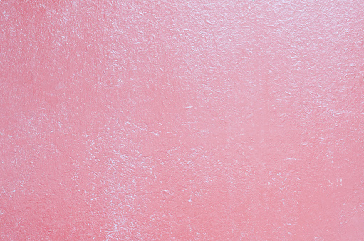 Pink textured background from an old painted board