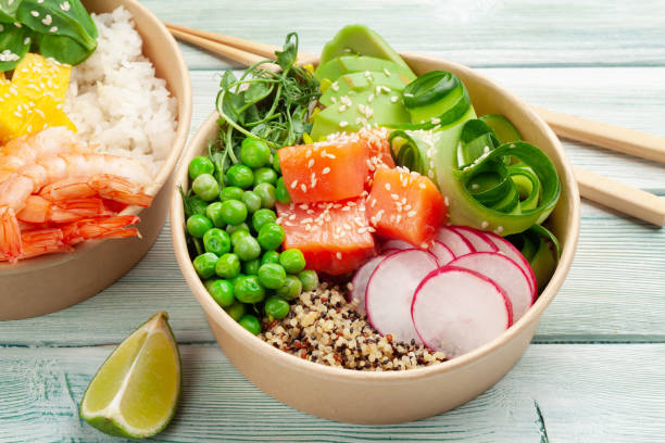 istock Poke bowls with shrimps, salmon, avocado and mango 1322629525