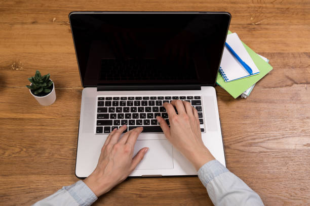 istock Hands close-up. Working on a computer, laptop. Office background. Online work. Typing 1322629547