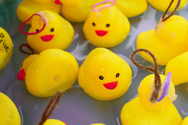 istock Yellow rubber ducks swim in pool 1322629865