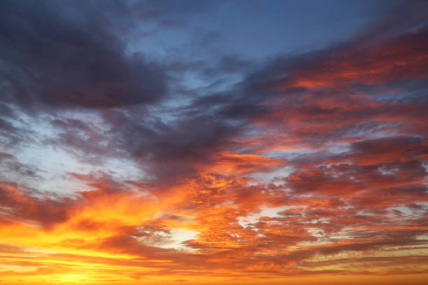 istock Sunset on colorful dramatic sky with red and orange clouds 1322630868