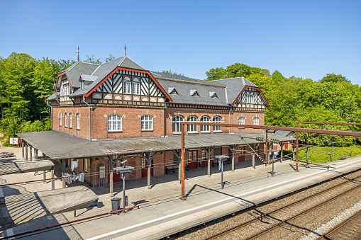 Suburban train station in a small suburb called Skodsborg north of Copenhagen. Most of the stations at this line are build in this distinctive style, which in Denmark are considered as German.