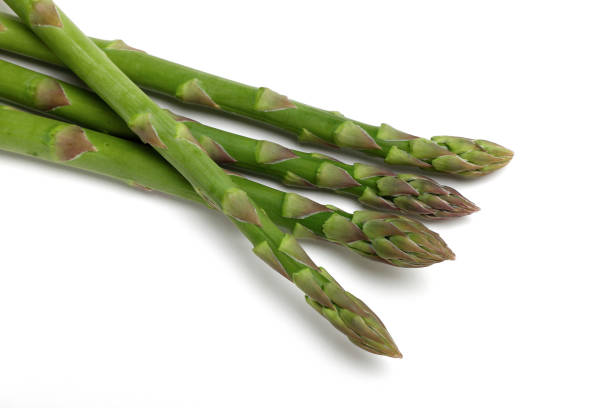 istock Fresh green asparagus on white background 1322632526
