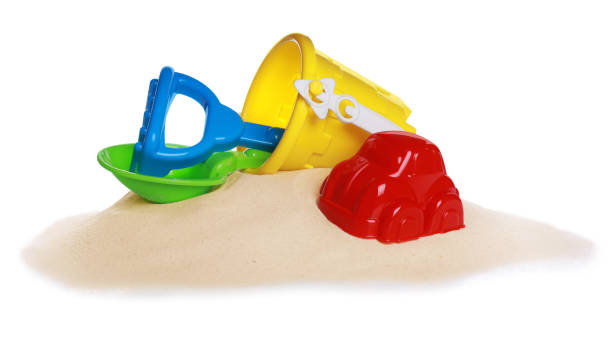 istock Colorful beach toy set with sand isolated on white 1322639612