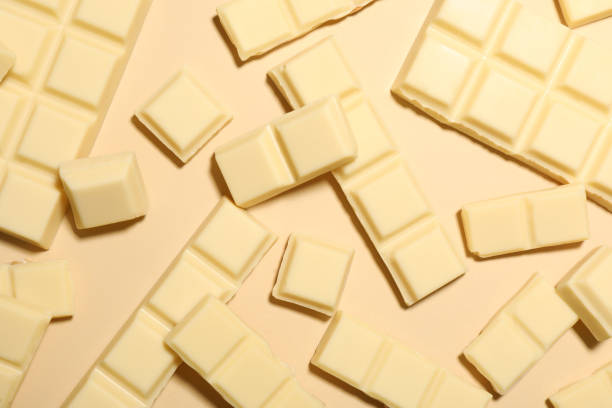 istock Delicious white chocolate on beige background, flat lay 1322640495