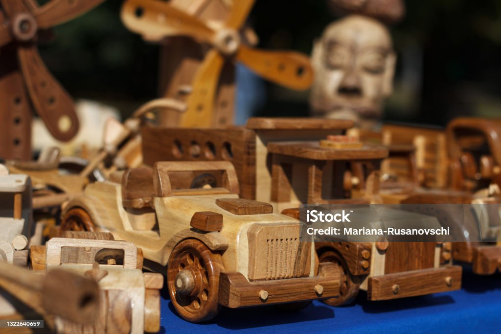 Wood carving, exhibition of professionally carved cars, trucks for children, toys Wood carving, exhibition of professionally carved cars, trucks for children, beauty toys Art Stock Photo