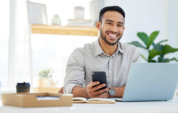 istock Shot of a young man using his cellphone at work in a modern office 1322642229