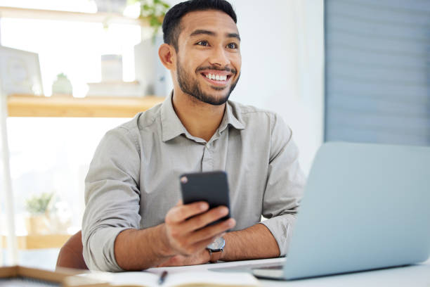 istock Shot of a young man using his cellphone at work in a modern office 1322642234