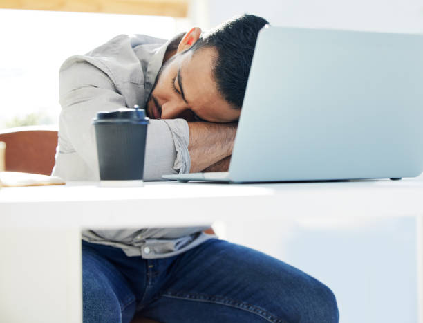 istock Shot of a young man taking a nap at work in a modern office 1322642250
