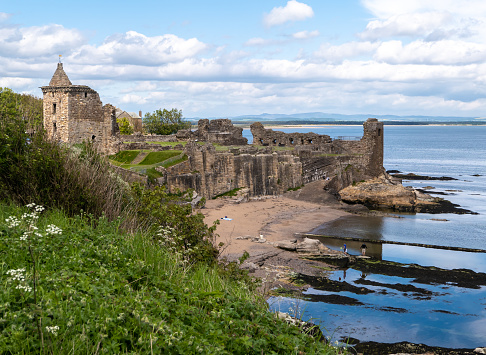 6th June 2021: Coastal path viewpoint of St Andrews Castle ruin, on the Fife coastline, overlooking the North Sea, on the east coast of Scotland. Located in the Royal Burgh of St Andrews, the castle dates back to 1189. It is a famous landmark and visitor attraction for those coming to the popular university town of St Andrews. It used to be the home of the wealthy and powerful bishops, before Protestant Reformation, when St Andrews was the ecclesiastical centre of Scotland. Now maintained and looked after by Historic Environment Scotland.