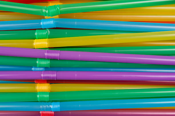 istock Heap of colorful plastic straws for drinks as background, closeup 1322644398
