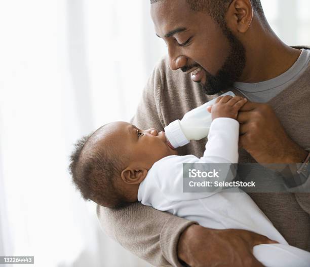 Father Feeding Son Stock Photo - Download Image Now - Baby - Human Age, Father, Baby Bottle