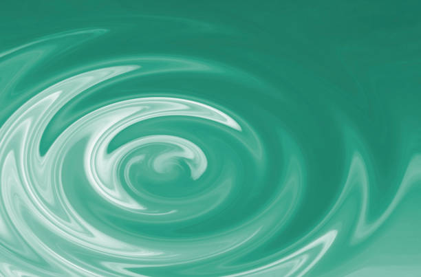 istock Abstract circles on the surface of emerald colored water as a background or backdrop 1322644454