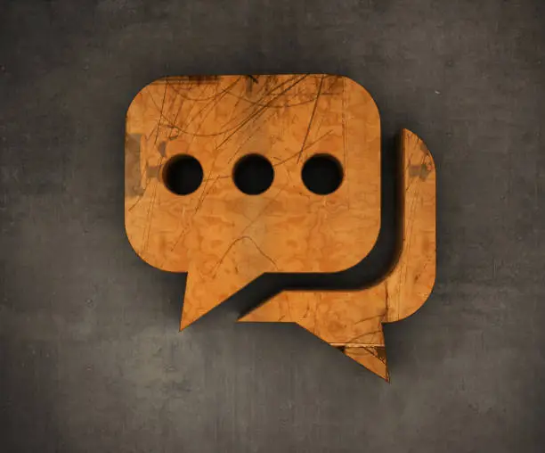 Photo of Wooden Speech Bubble Symbol on The Wall