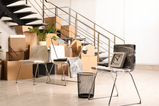 istock Cardboard boxes with packed stuff near stairs in office. Moving day 1322647417