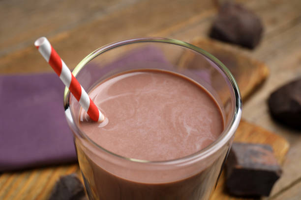 istock Delicious chocolate milk in glass, closeup view 1322648229