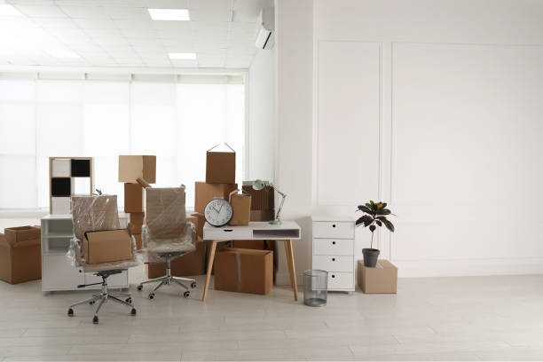 istock Cardboard boxes and packed stuff in office. Moving day 1322648369