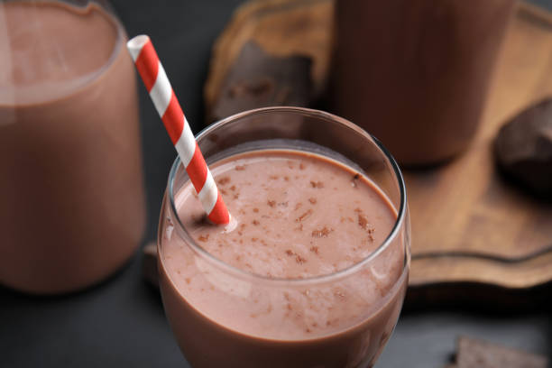 istock Delicious chocolate milk in glass, closeup view 1322648449