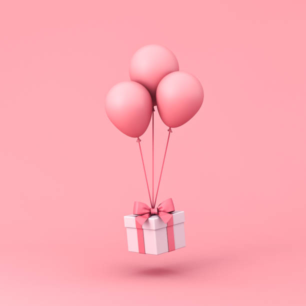 słodkie pudełko na prezent latające z różowymi pastelowymi kolorowymi balonami izolowanymi na jasnoróżowym tle z cieniem minimalnym koncepcyjnym - gift pink box gift box zdjęcia i obrazy z banku zdjęć