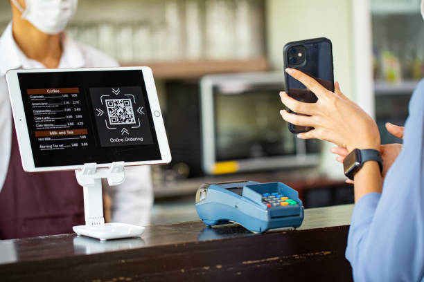 Customer using smartphone for payment with contactless Customer using smartphone for payment with contactless for prevent touching by transfer money with phone.Show proof of transfer money. point of sale stock pictures, royalty-free photos & images