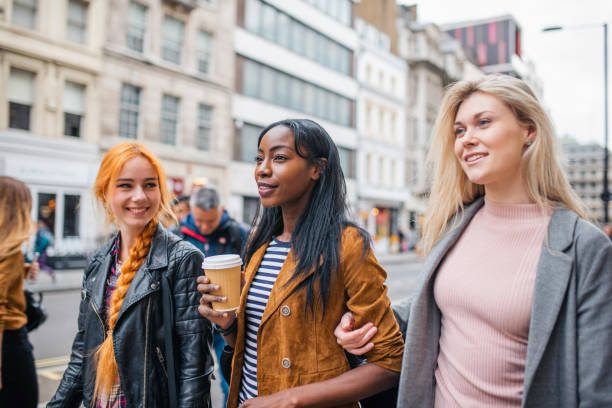 istock Multi ethnic group of friends having fun while shopping in London 1322656804