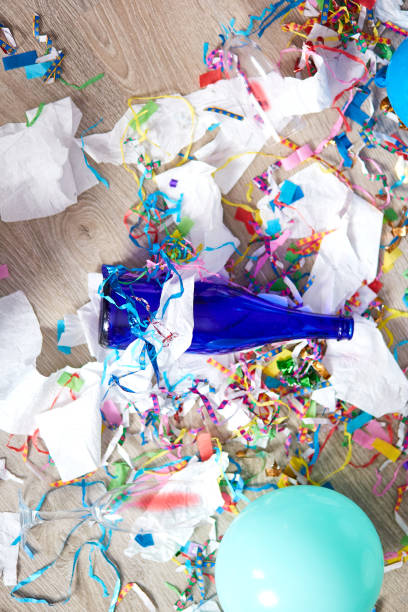 istock Top view of floor with after a party celebration with empty blue bottles 1322657957