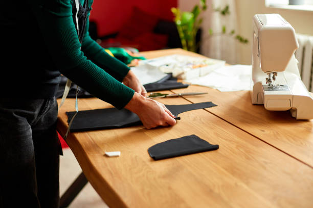 istock Step by step, woman dressmaker female measuring sewing pattern On Table 1322658122