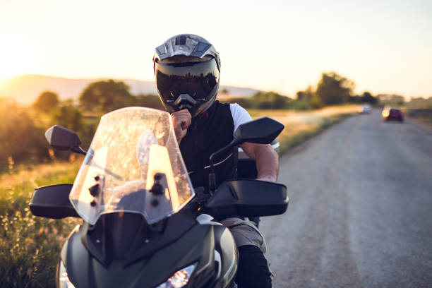 istock Motorcyclist on the country road. Copy Space 1322659587