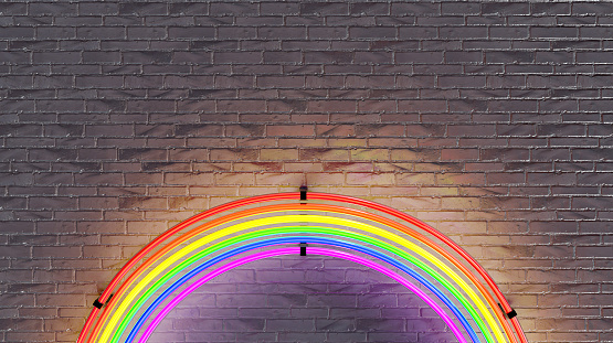 neon rainbow lamp with brick wall in the background. lgbtq+ concept, pride day. 3d render