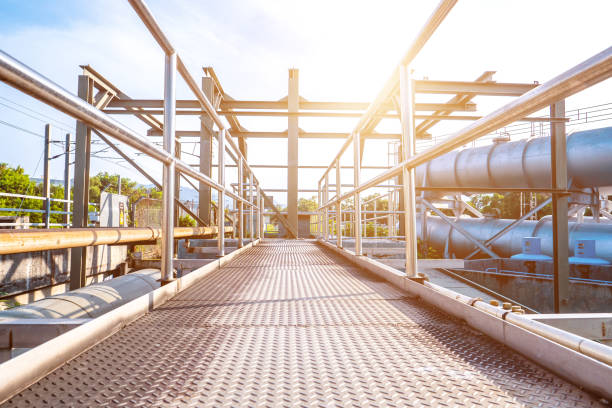 istock Bridge or walk-way over a filtering tank at a wastewater plant 1322659947