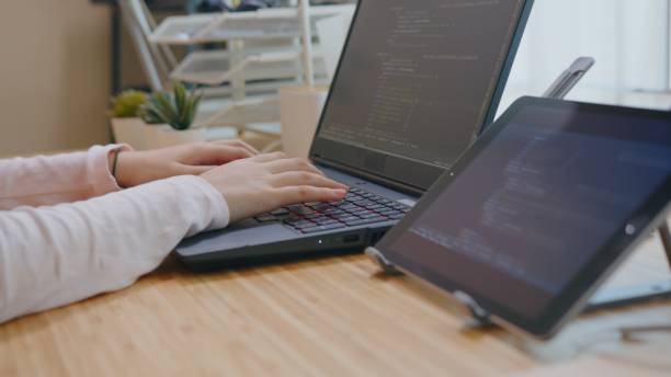 istock Student Teenager typing or coding computer language on laptop at home 1322661871