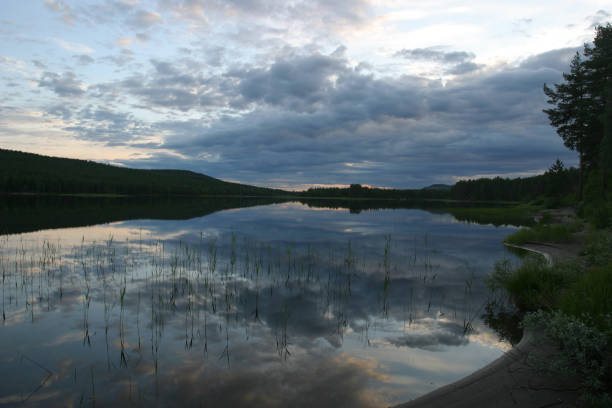 Glassy lake in the early morning. East Battle Lake, Minnesota, USA