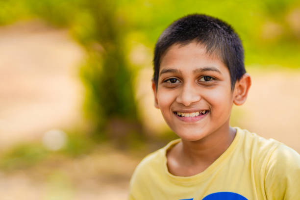 Cute Indian child studying at home.