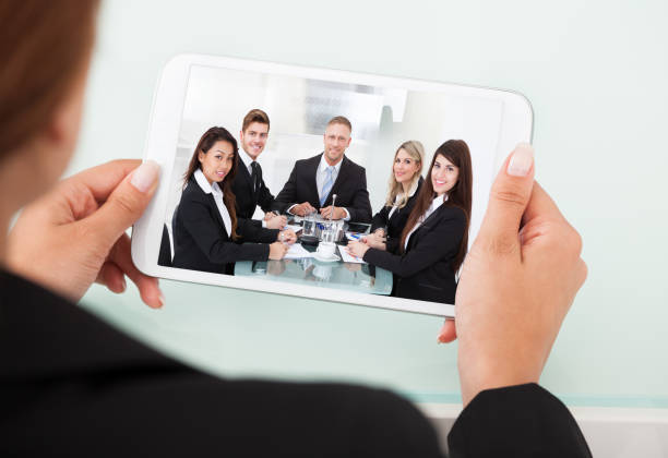 istock Businesswoman Video Conferencing With Team On Digital Tablet 1322665853