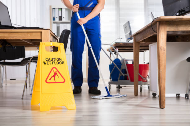 istock Janitor Cleaning Floor In Office 1322665891