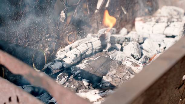 istock Firewood fire flames. Metal brazier grill. Close up. 1322666903