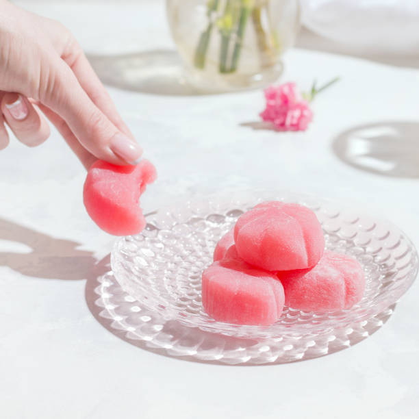 istock Mochi pink japanese sweets on a white table 1322668412
