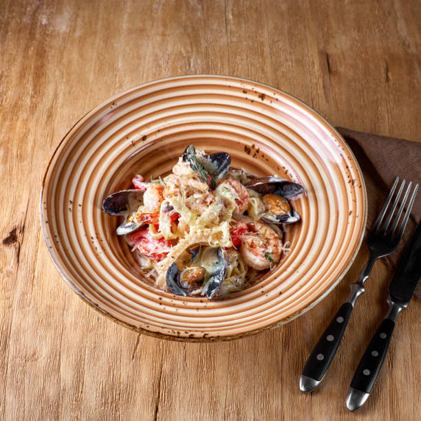 istock Seafood pasta - Spaghetti with clams, prawns, sea scallops . 1322668966