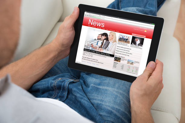 istock Person Watching News On Digital Tablet 1322669262