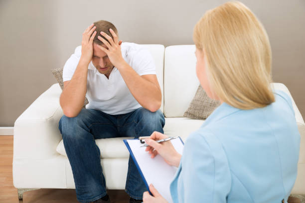 istock Depressed Patient In Front Of Psychiatrist 1322669375