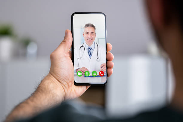 istock Man Having Video Chat With Doctor On Phone 1322670377